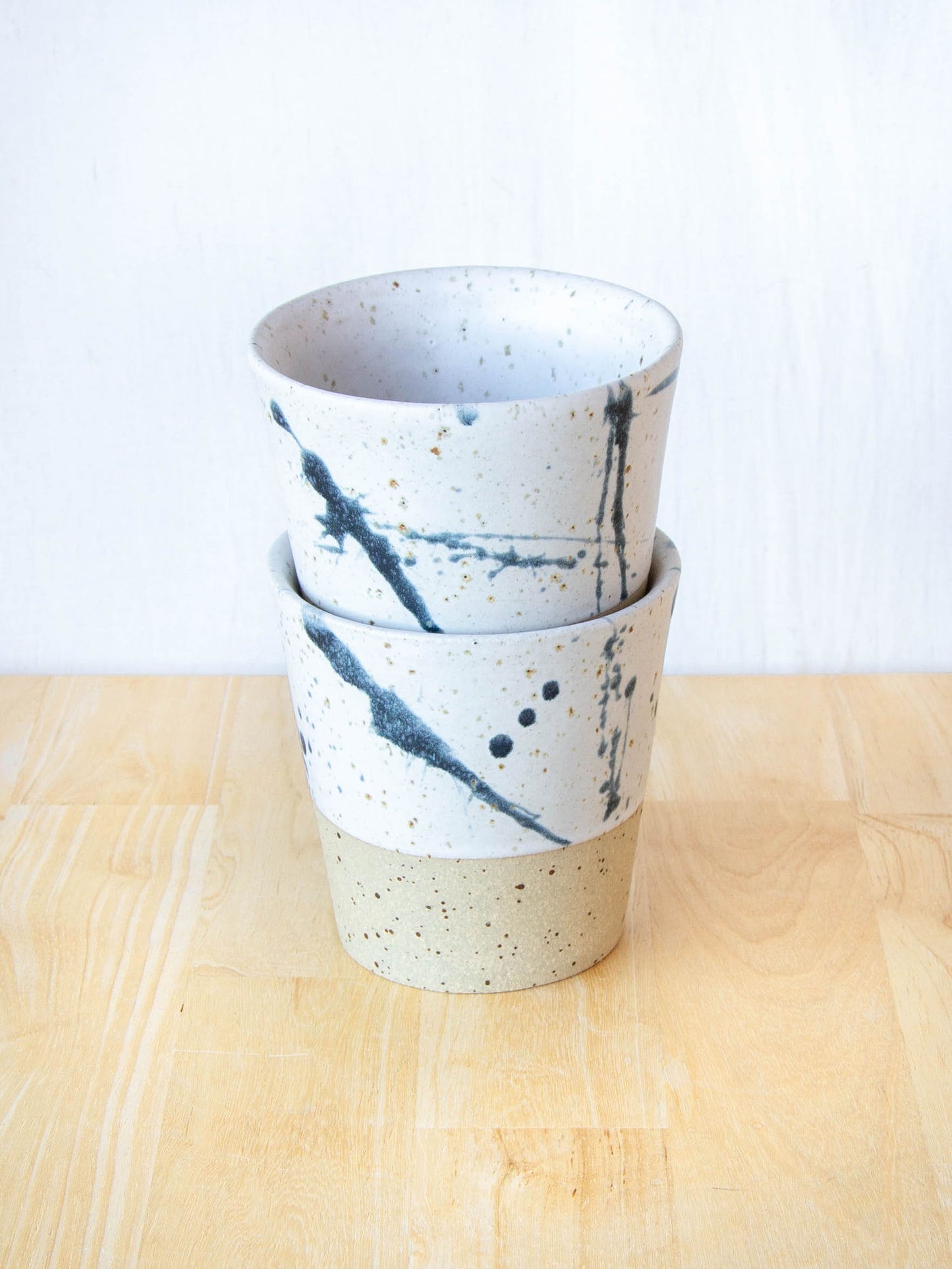 Ceramic coffee cup handmade in New Zealand by Land and Line Ceramics, single-use free, travel cup. Modern rustic design with a wabi sabi, japandi style