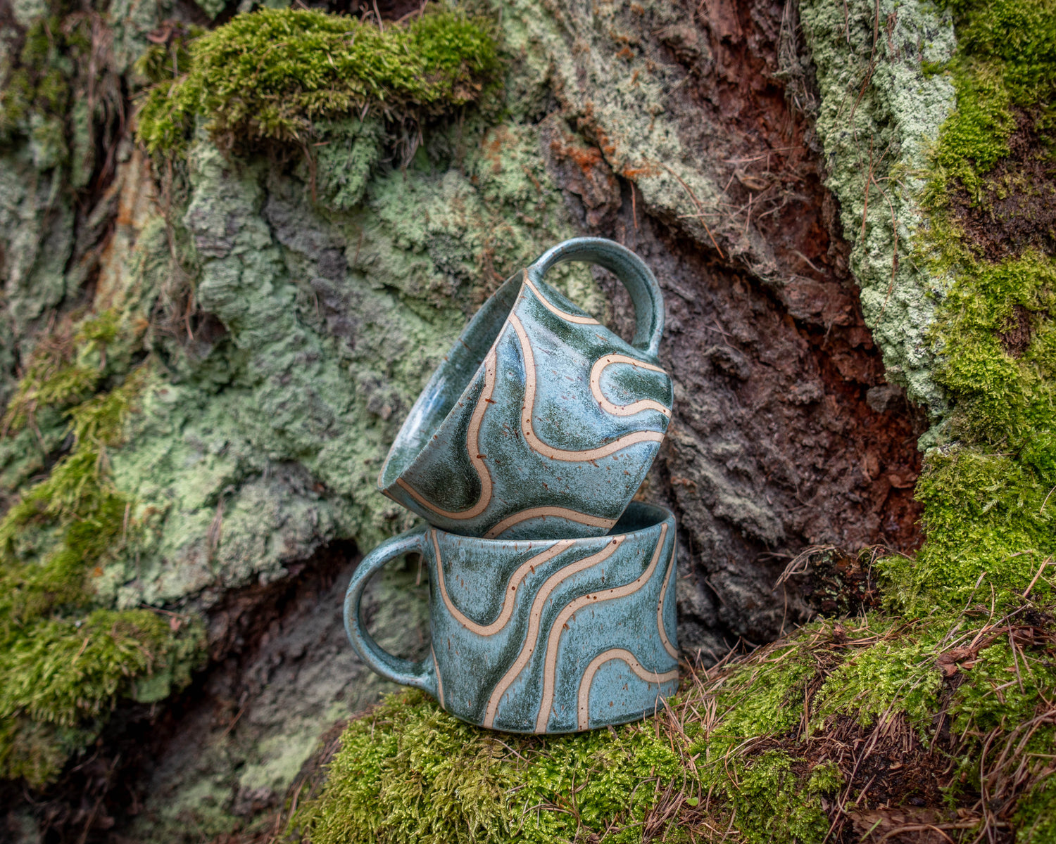 handmade mug made in New Zealand by Land and Line Ceramics with abstract line art mountain design