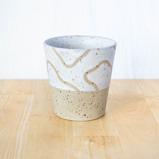 Handmade ceramic coffee tumbler by Land and Line Ceramics with abstract topographic line art design