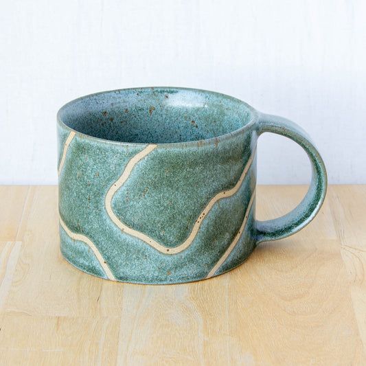 handmade ceramic mug with topographic map design made in New Zealand by Land and Line Ceramics