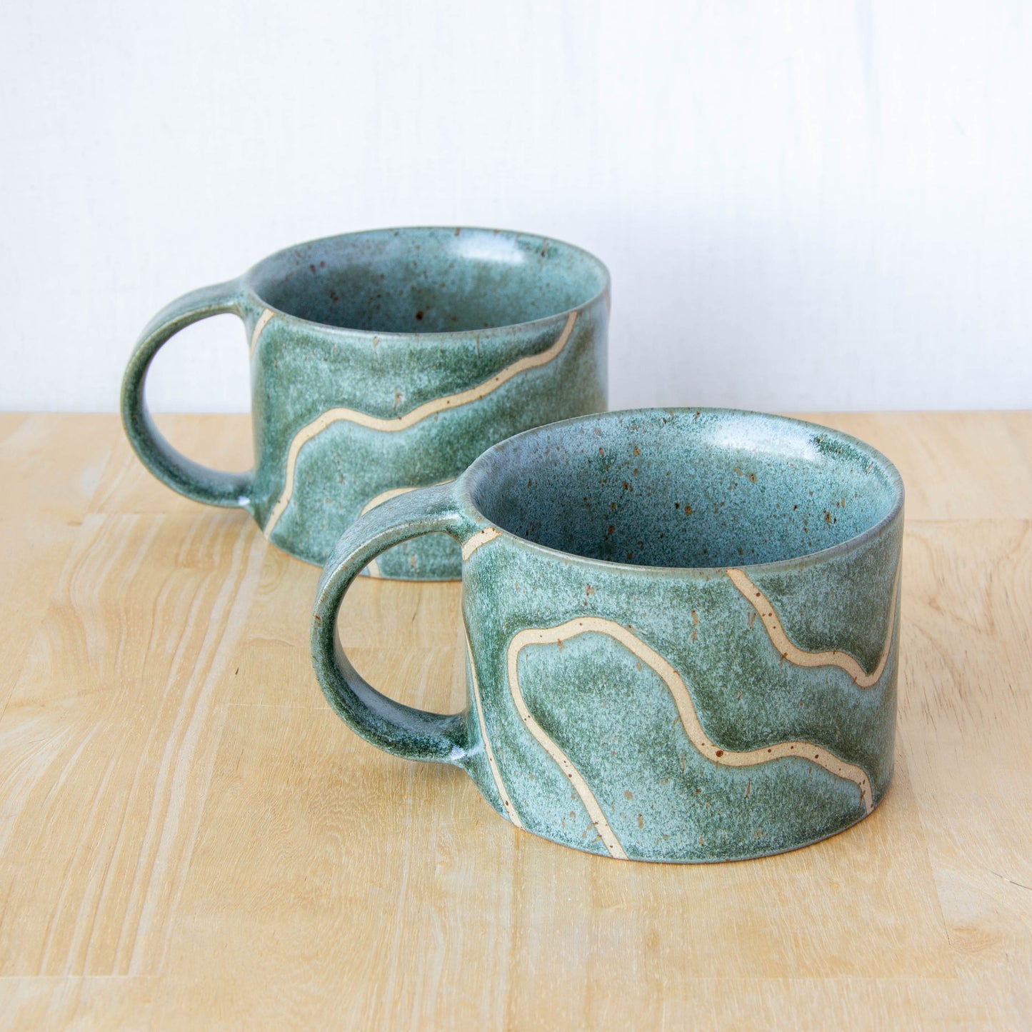 handmade ceramic mug with topographic map design made in New Zealand by Land and Line Ceramics