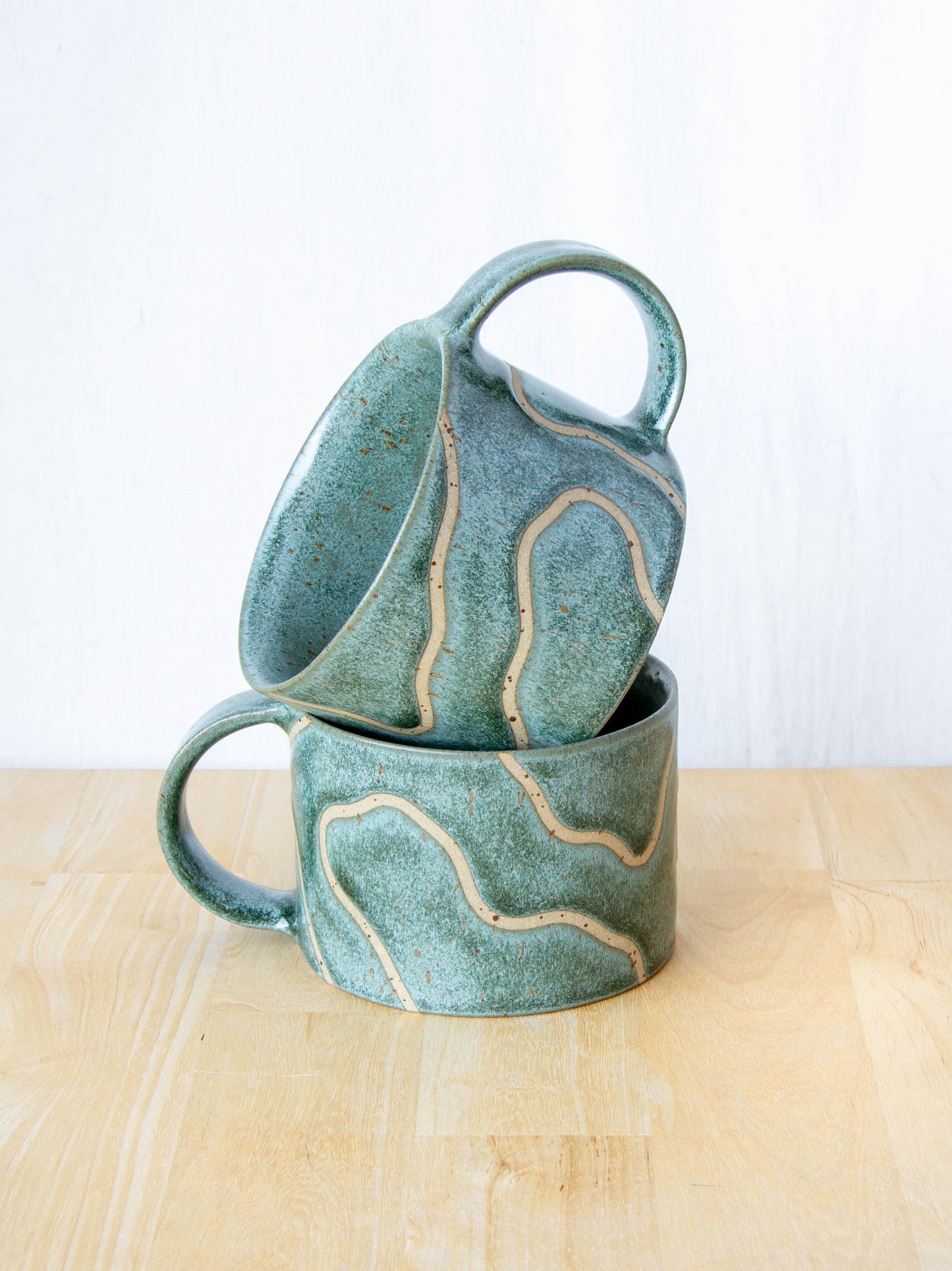 handmade ceramic mug with topographic map design made in New Zealand by Land and Line Ceramics