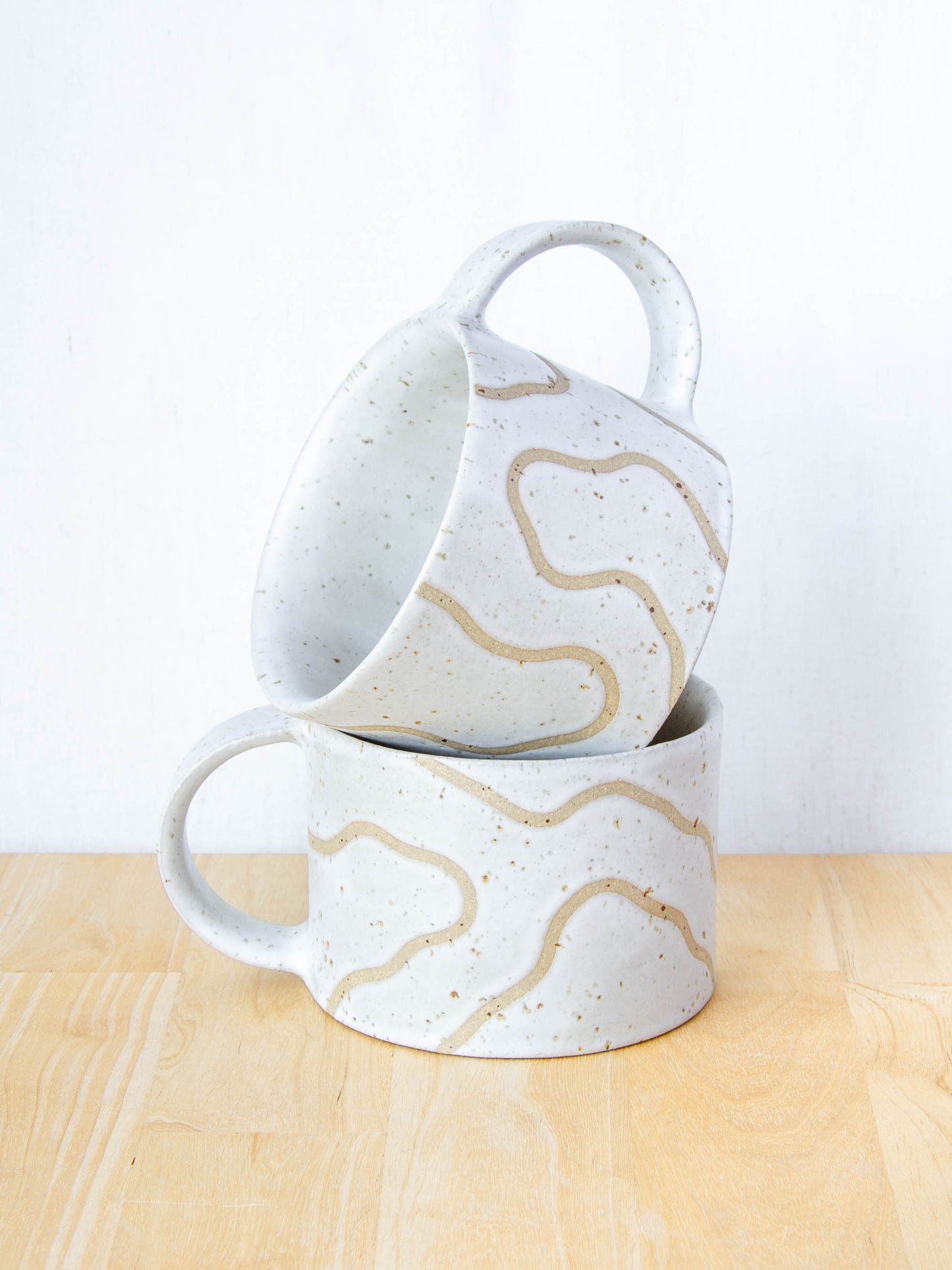 handmade ceramic mug with topographic map design made in New Zealand by Land and Line Ceramics