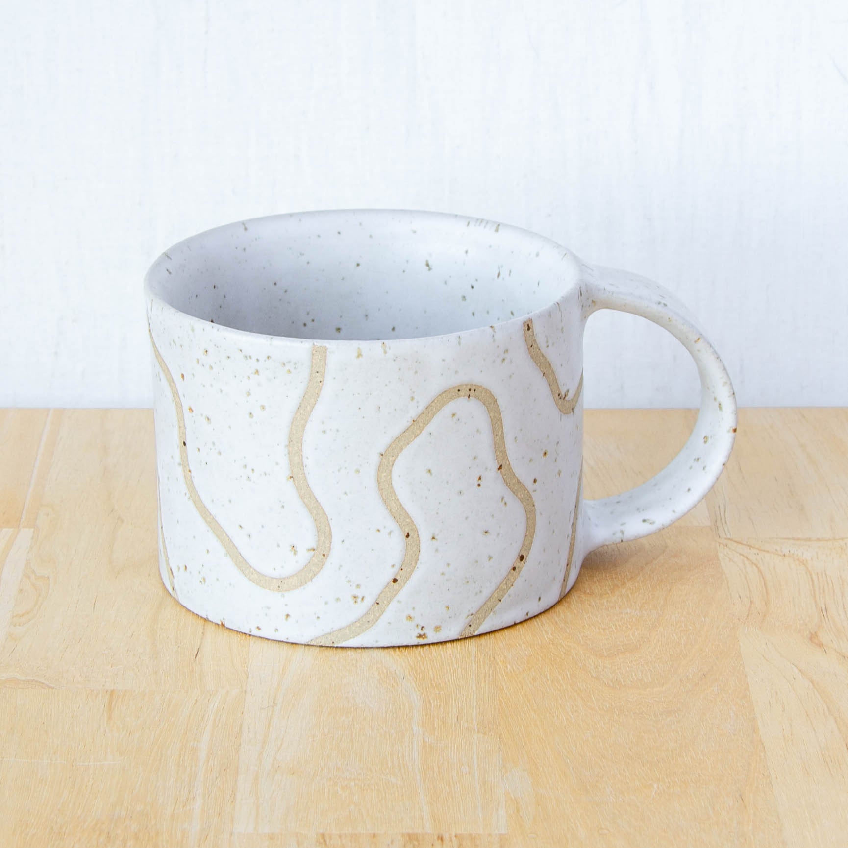 handmade ceramic mug with topographic map design made in New Zealand by Land and Line Ceramics