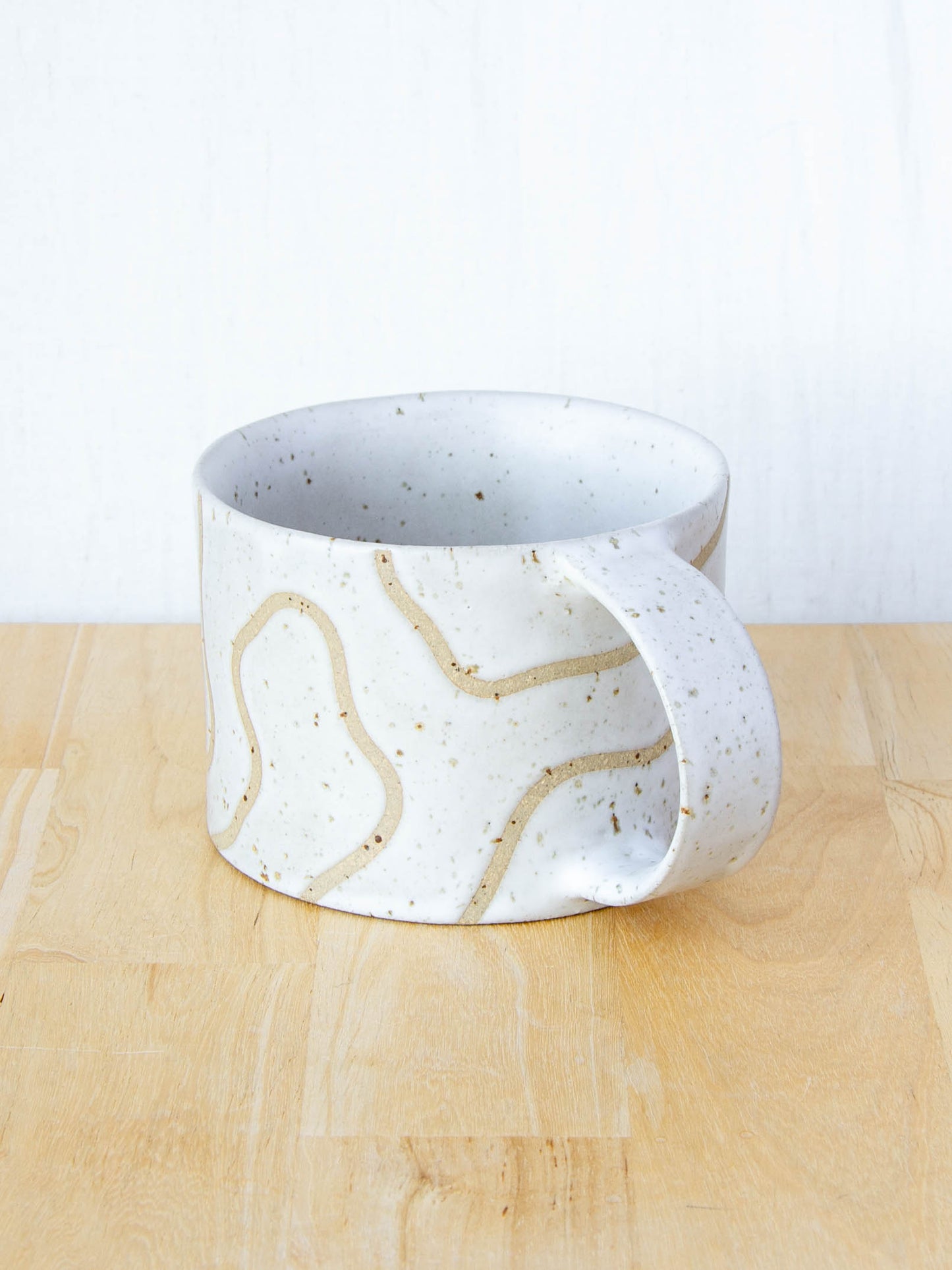 handmade ceramic mug with topographic map design made in New Zealand by Land and Line Ceramics
