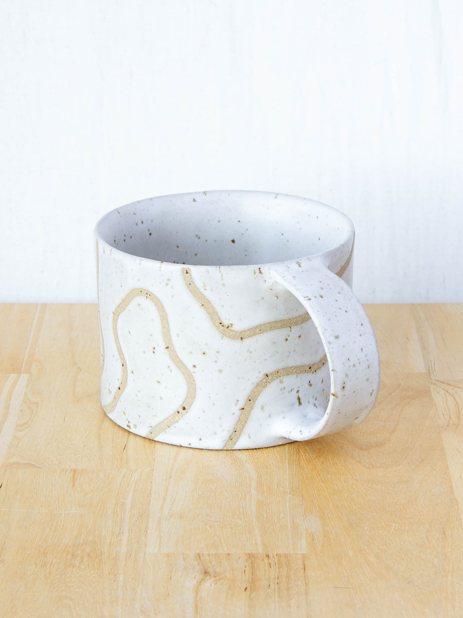 handmade ceramic mug with topographic map design made in New Zealand by Land and Line Ceramics