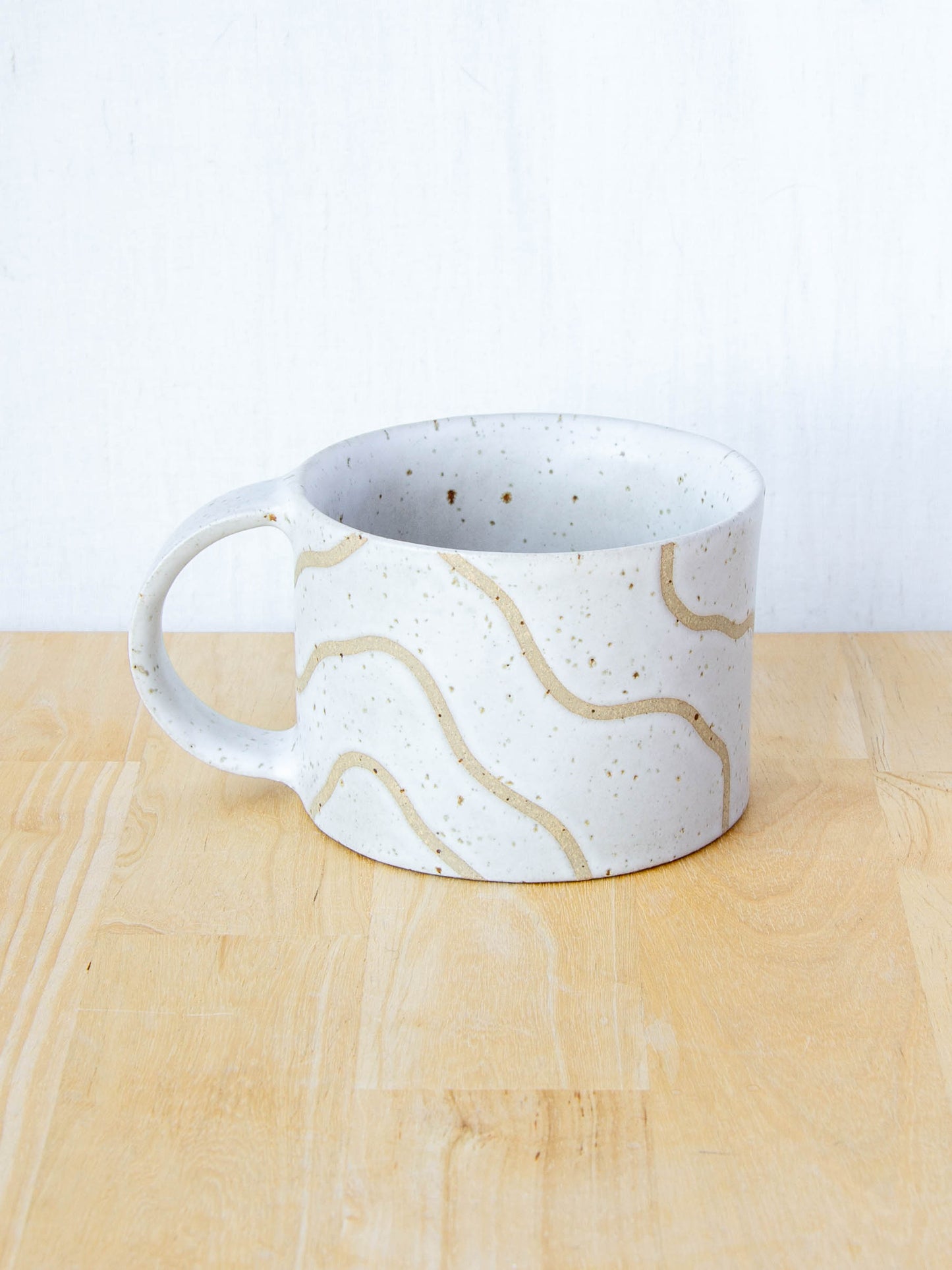 handmade ceramic mug with topographic map design made in New Zealand by Land and Line Ceramics