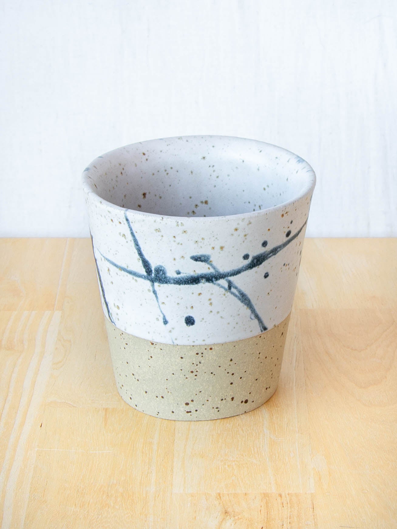 Ceramic coffee cup handmade in New Zealand by Land and Line Ceramics, single-use free, travel cup. Modern rustic design with a wabi sabi, japandi style