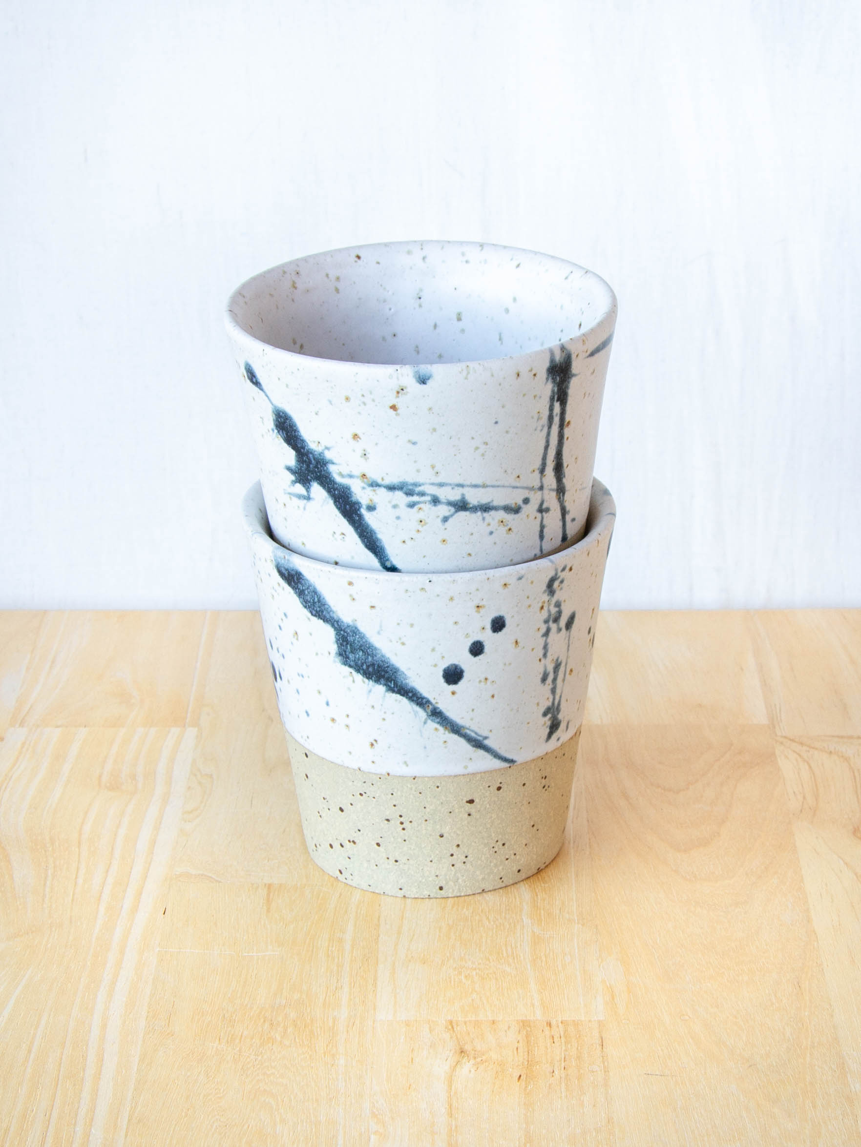 Ceramic coffee cup handmade in New Zealand by Land and Line Ceramics, single-use free, travel cup. Modern rustic design with a wabi sabi, japandi style