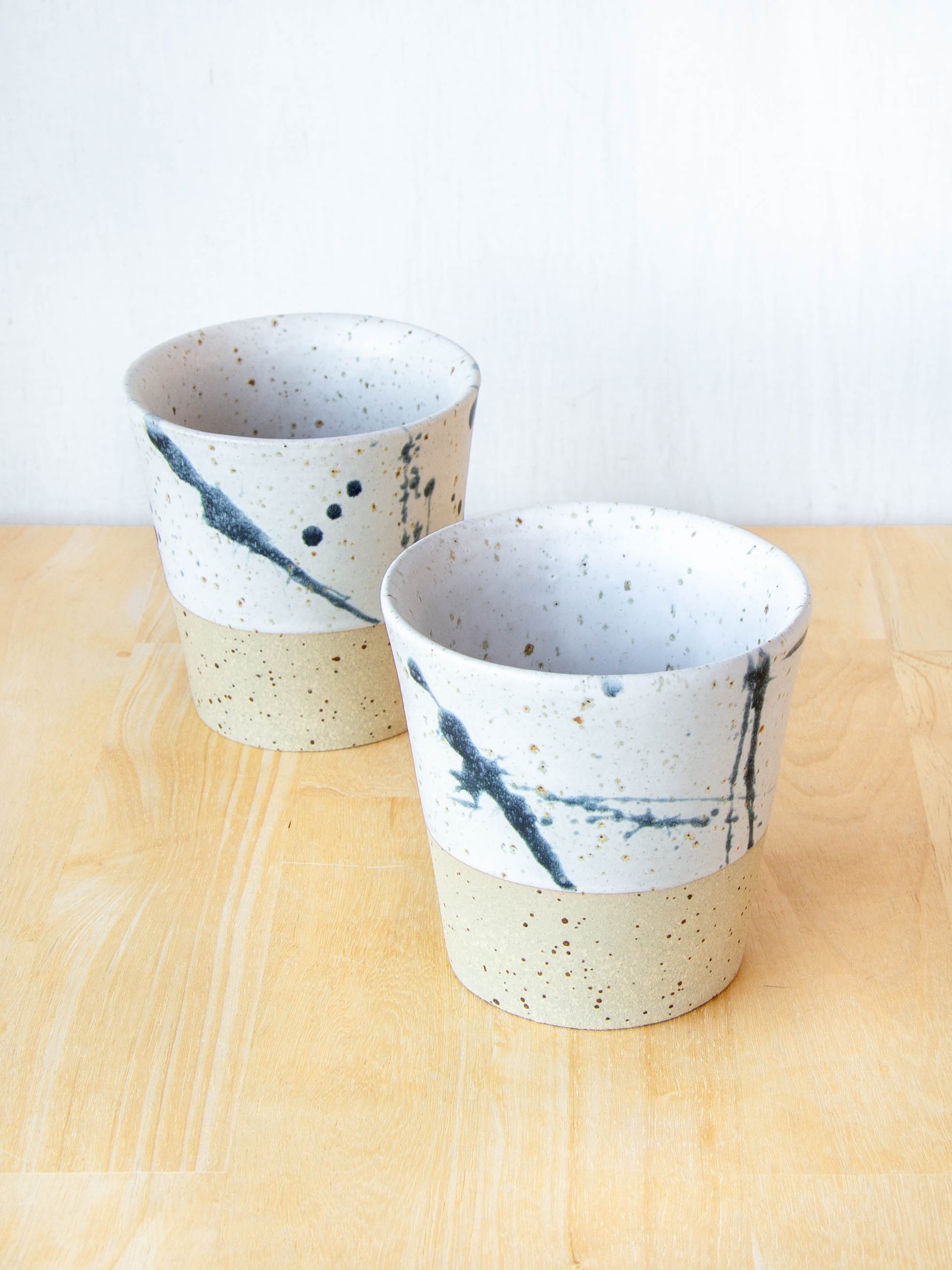 Ceramic coffee cup handmade in New Zealand by Land and Line Ceramics, single-use free, travel cup. Modern rustic design with a wabi sabi, japandi style