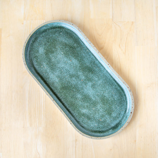 rounded oblong pill shaped plate handmade cheese board platter rustic green glaze