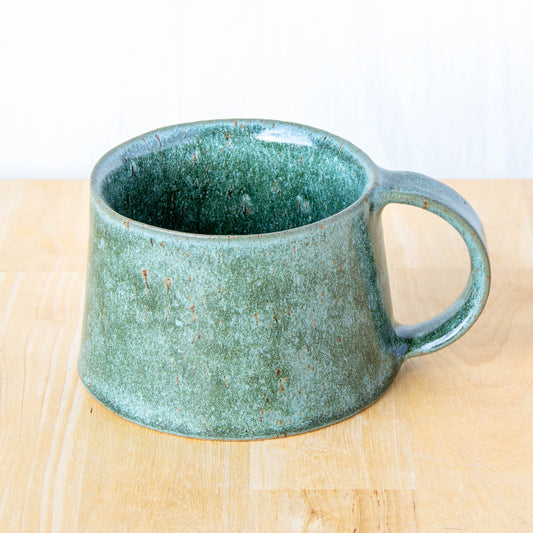 Handmade mug by Land and Line Ceramics New Zealand made pottery greenstone mug tapered mug with rustic wabi-sabi style glaze