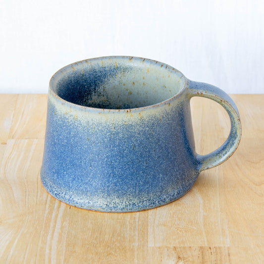 Handmade mug by Land and Line Ceramics New Zealand made pottery blue mug tapered mug with rustic wabi-sabi style glaze