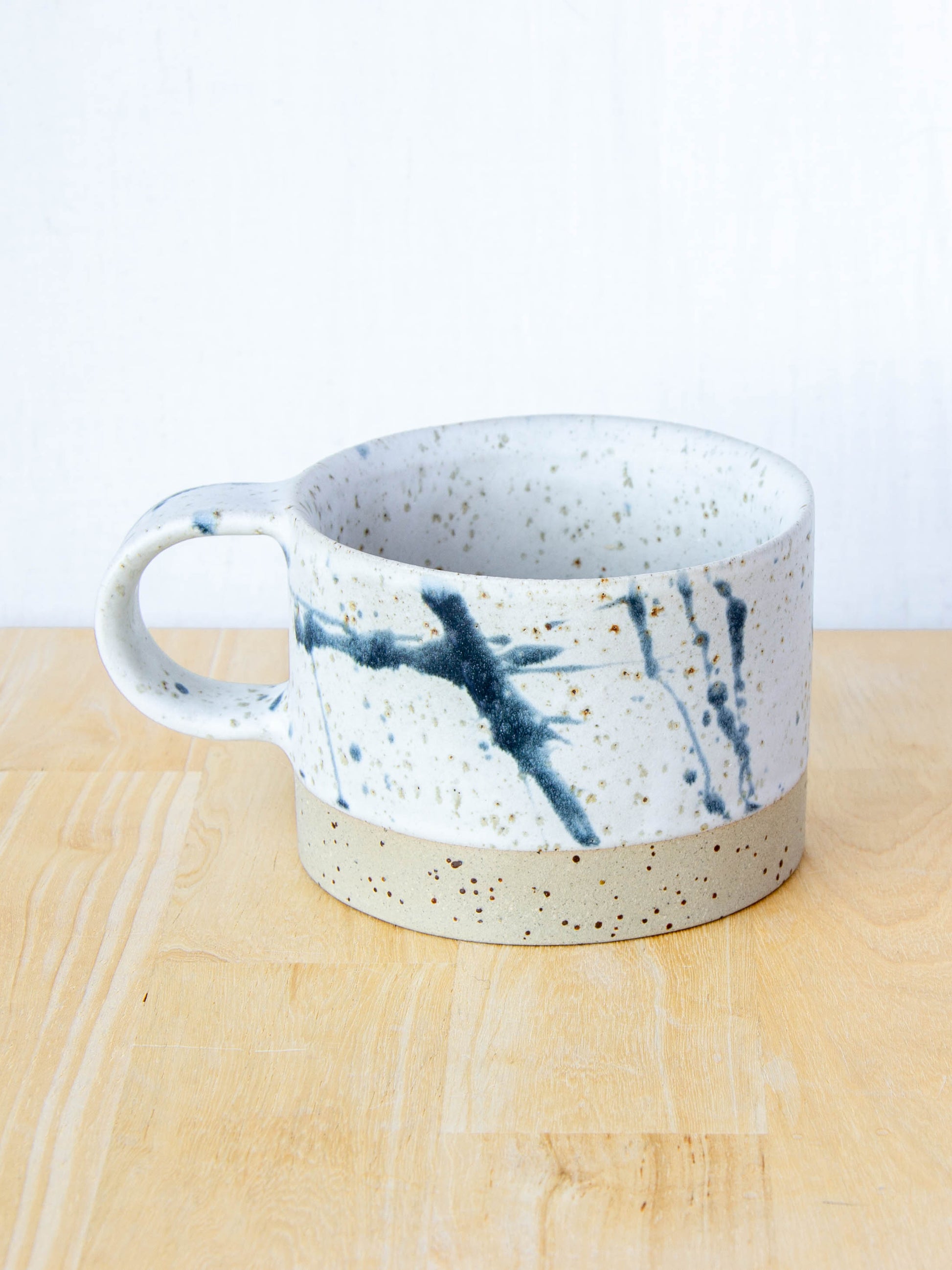 Ceramic coffee cup handmade in New Zealand by Land and Line Ceramics, Modern rustic design with a wabi sabi, japandi style